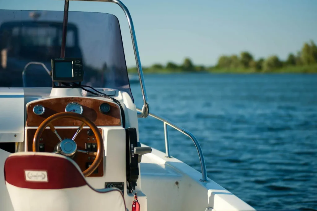 The helm of a boat on open water